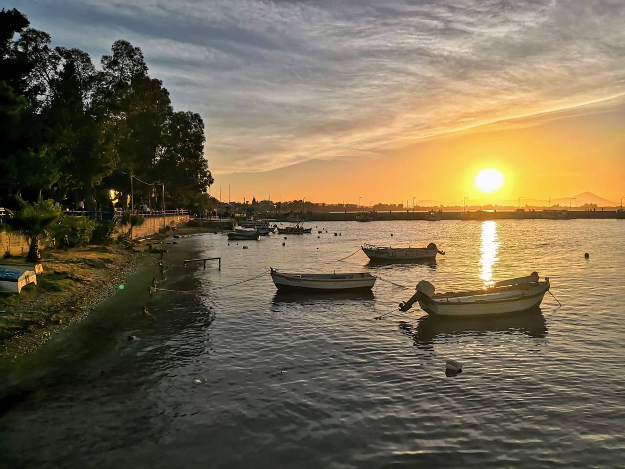 Sunset parked fishing boats